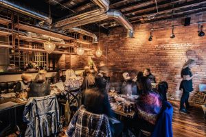 People drinking in one of the top 10 Newcastle bars, Pleased to Meet you